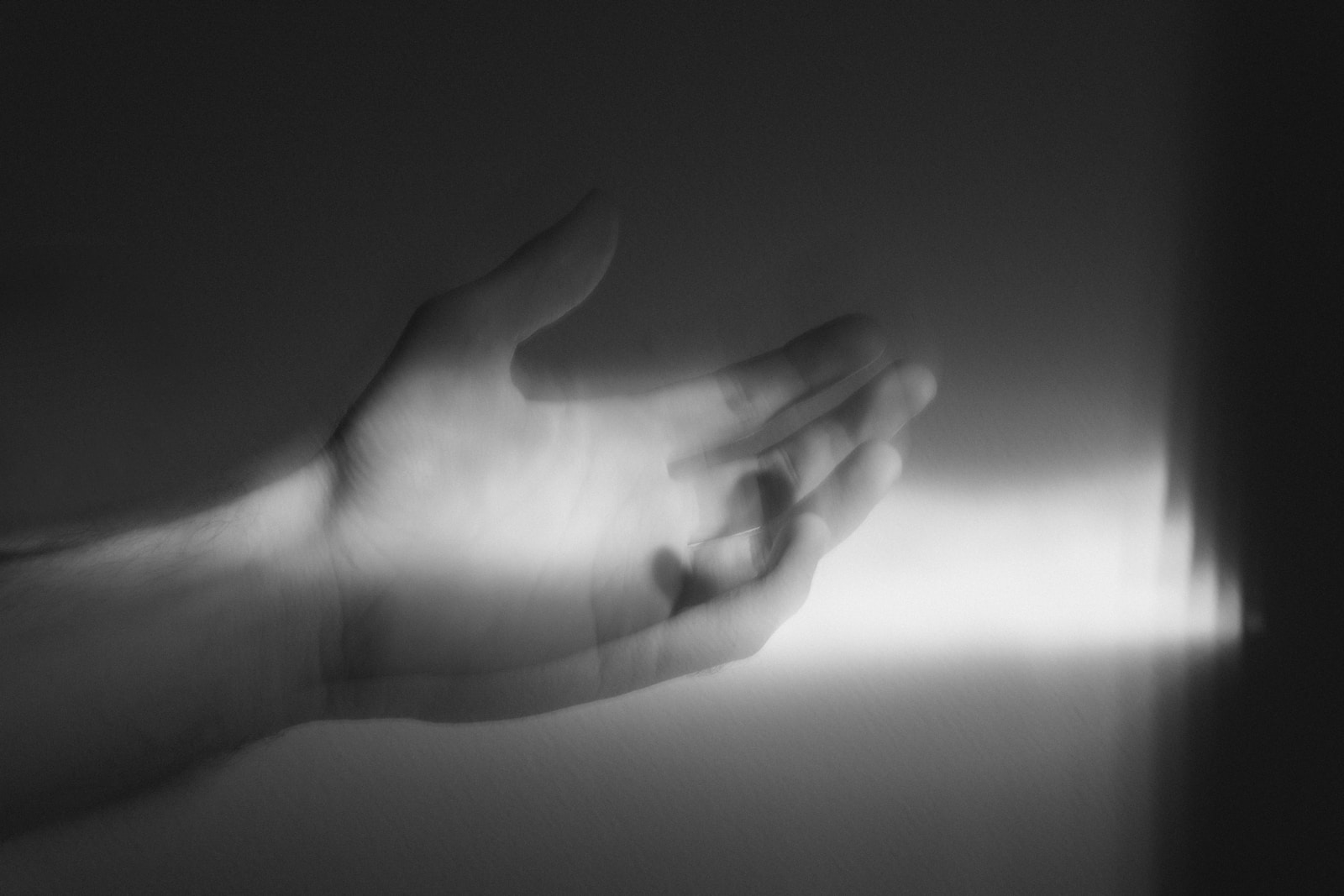 a black and white photo of a person's hand